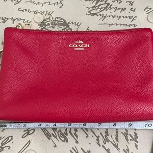 Bright pink Coach crossbody bag